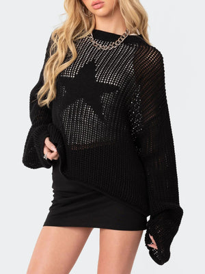 Black open knit sweater with a large starburst pattern, crew neck, and long sleeves.