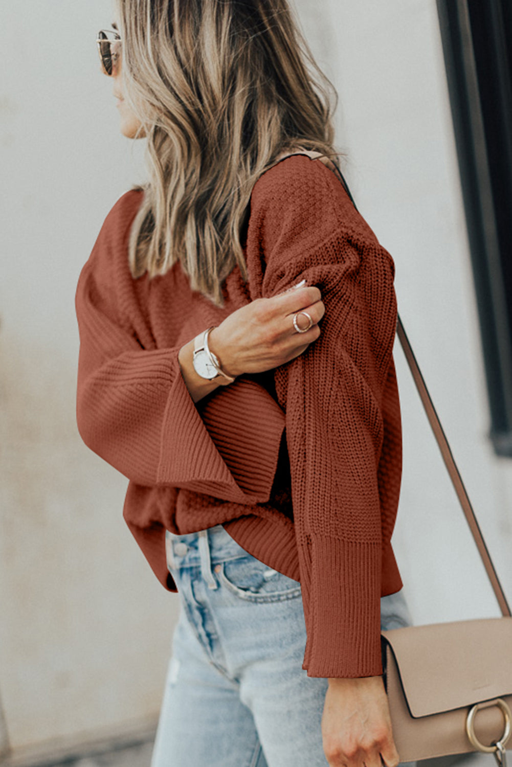 Textured knit sweater in ochre with bell sleeves and side slits.