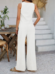 White linen tie-front palazzo pant set with sleeveless top and wide-leg pants.