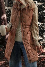 Brown diamond quilted longline vest with cinched waist detail and snap front.