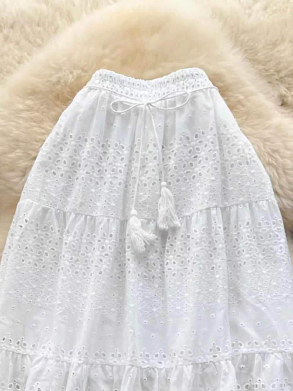 White eyelet tiered maxi skirt with tassel drawstring waist