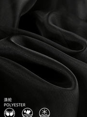 Black midi skirt with sheer overlay, made of polyester with a draped texture.