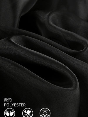 Black midi skirt with sheer overlay, made of polyester with a draped texture.