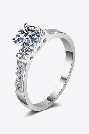 Silver rhodium engagement ring with large center stone and pavé band.