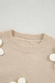 Tan knit sweater with embroidered white blooms, crew neck, acrylic.