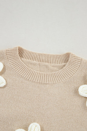 Tan knit sweater with embroidered white blooms, crew neck, acrylic.