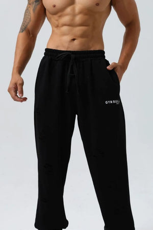 Black distressed jogger trousers with drawstring waist and Gym Bull logo.