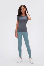 Gray seamless activewear tee with short sleeves and textured detailing.