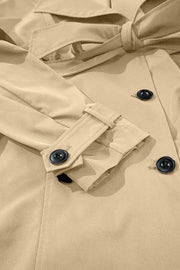 Classic trench coat in Dust Storm with bow-tie waist and button details.