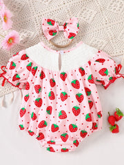 Baby pink strawberry print smocked one-piece with puff sleeves and matching headband.