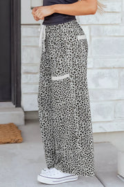Animal print wide leg pants with drawstring waist and white trim pockets.