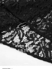 Black lace maxi skirt with intricate sheer floral detail and scalloped hem.