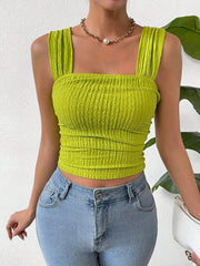 Textured crinkle strap crop top in yellow-green with ruched detail.