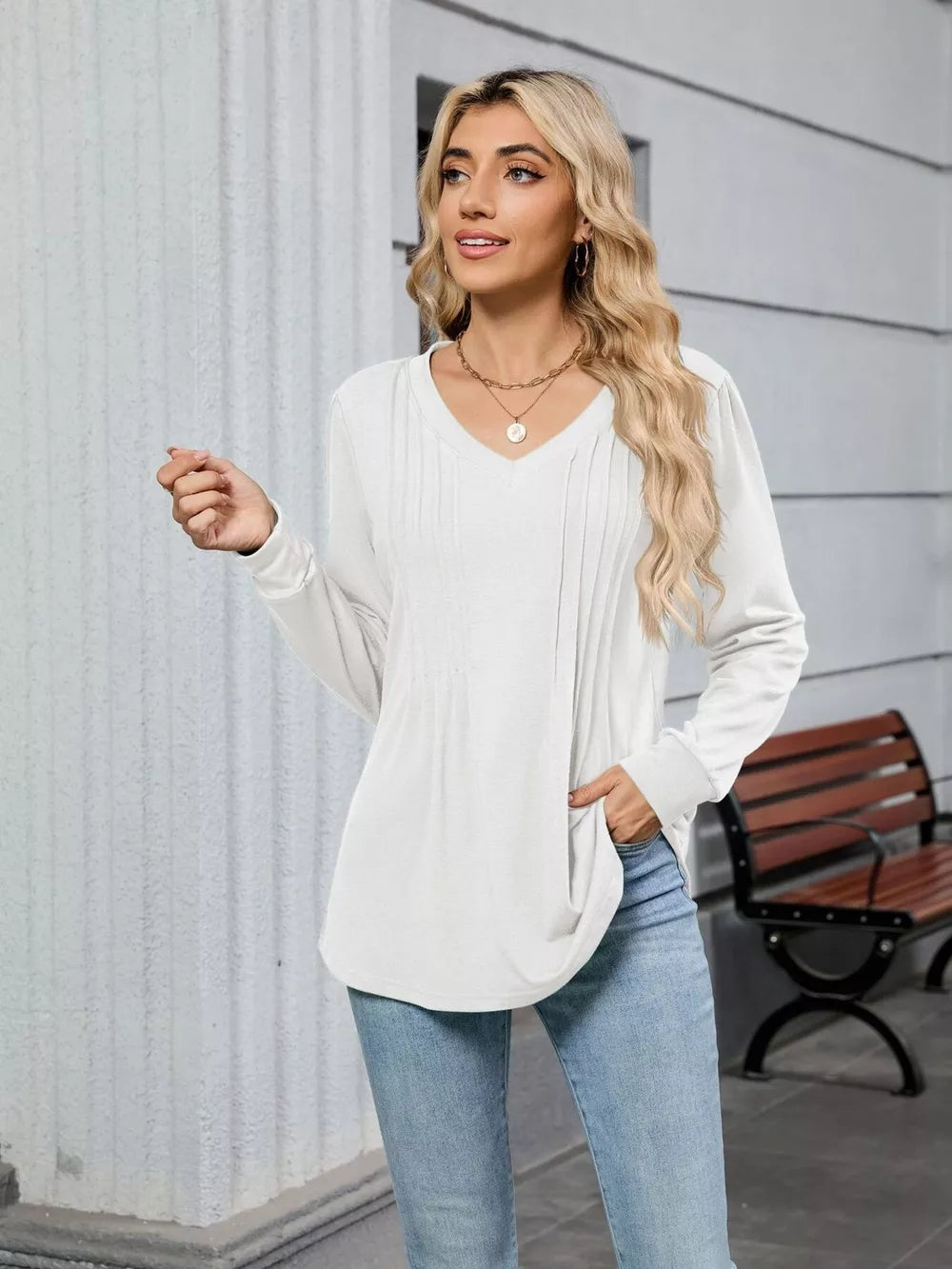 White V-neck long sleeve maternity t-shirt with subtle pintuck detail and relaxed fit.