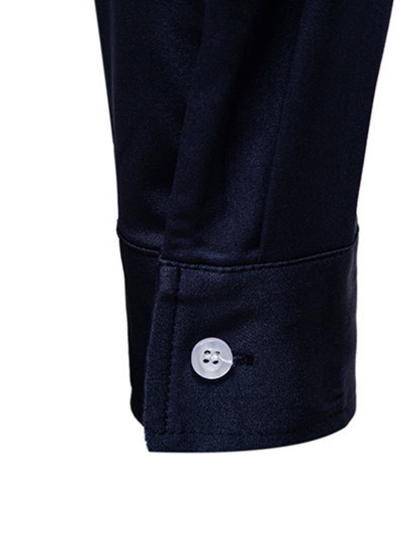 Men's navy blue button-up shirt cuff detail with white button.