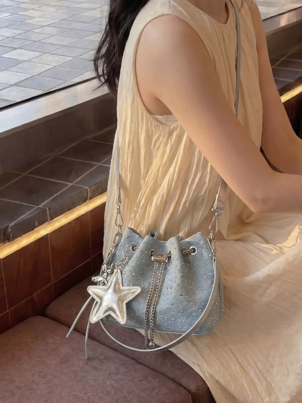 Drawstring Bucket Crossbody Bag in Blue, model styling view