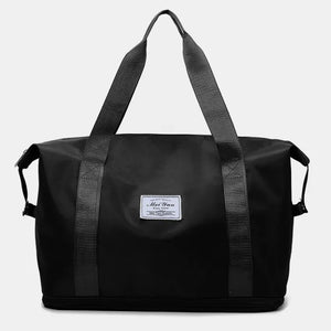 Black nylon shopper bag with dual straps and a white label.