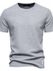 Gray textured crew-neck t-shirt knit with short sleeves and a small logo patch.