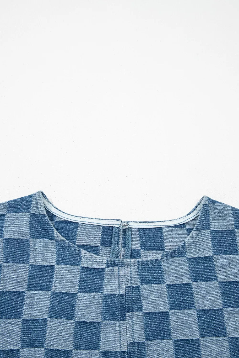 Checkered denim mini dress with frayed hems and a round neckline.