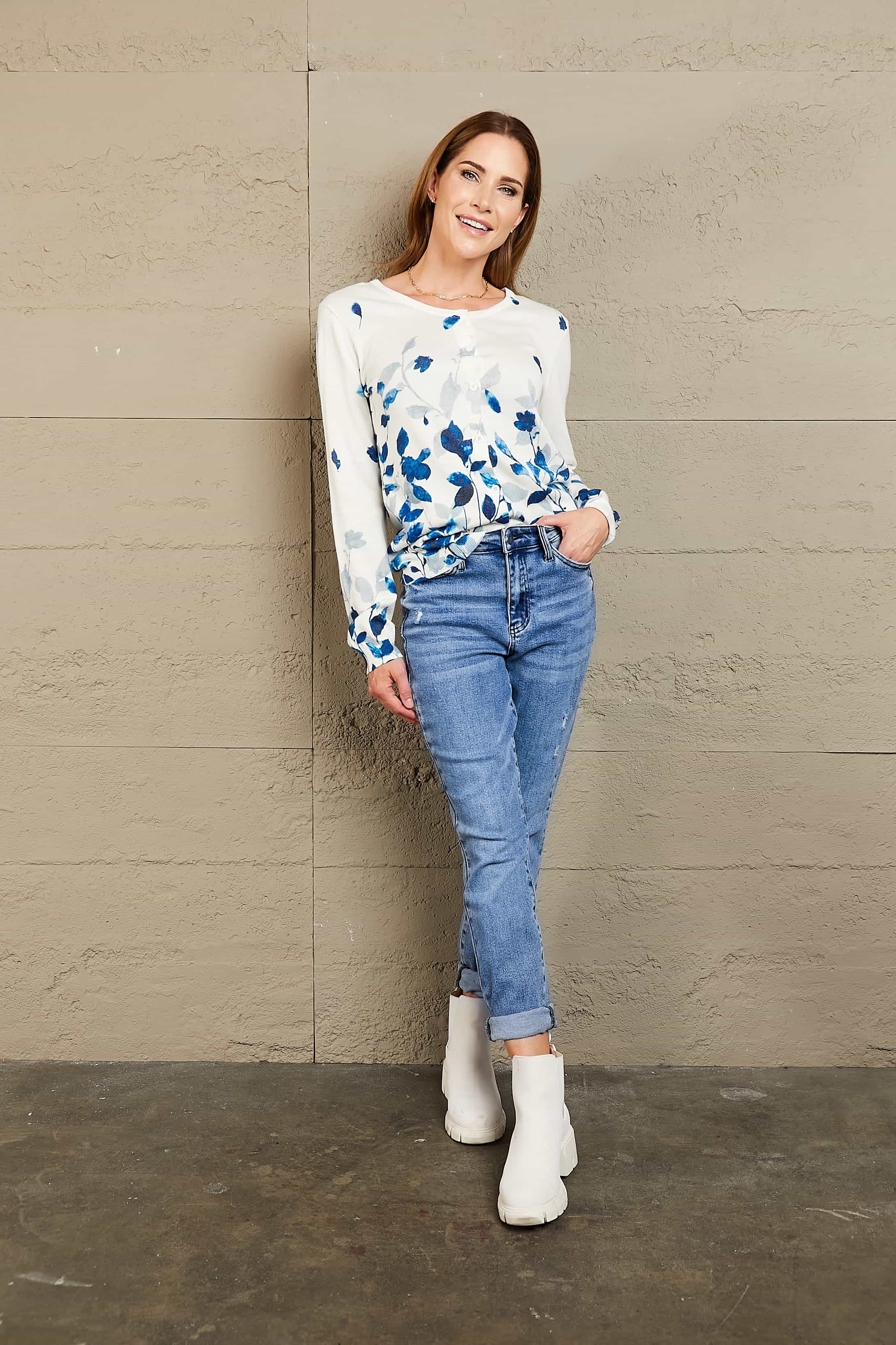 White crewneck cardigan with blue botanical print and button front
