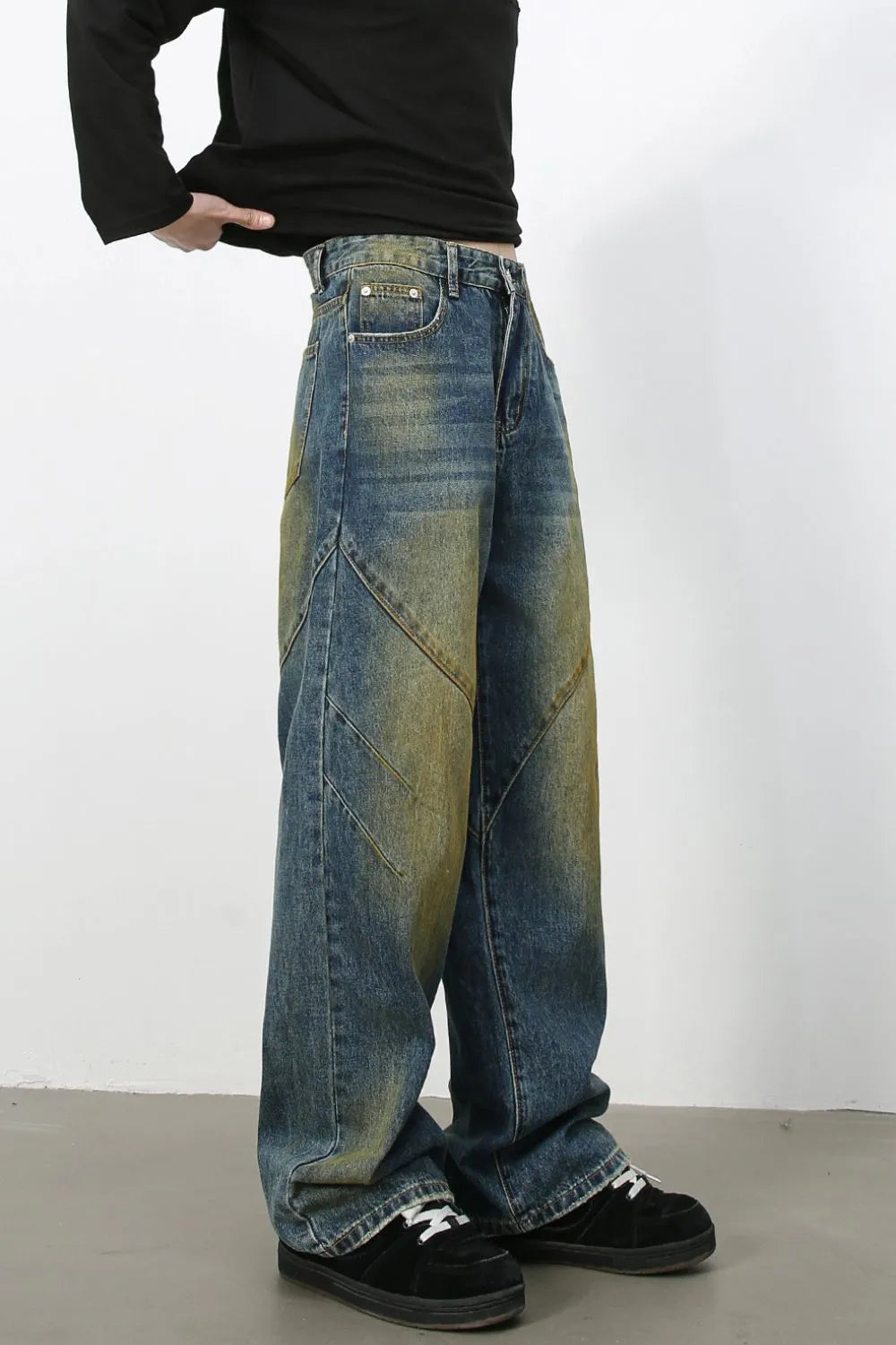 Panelled acid wash wide leg jeans in medium blue denim with a relaxed fit.