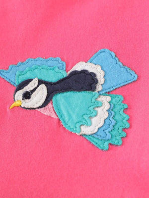 Strawberry cotton dress with colorful bird applique and ruffled sleeves.