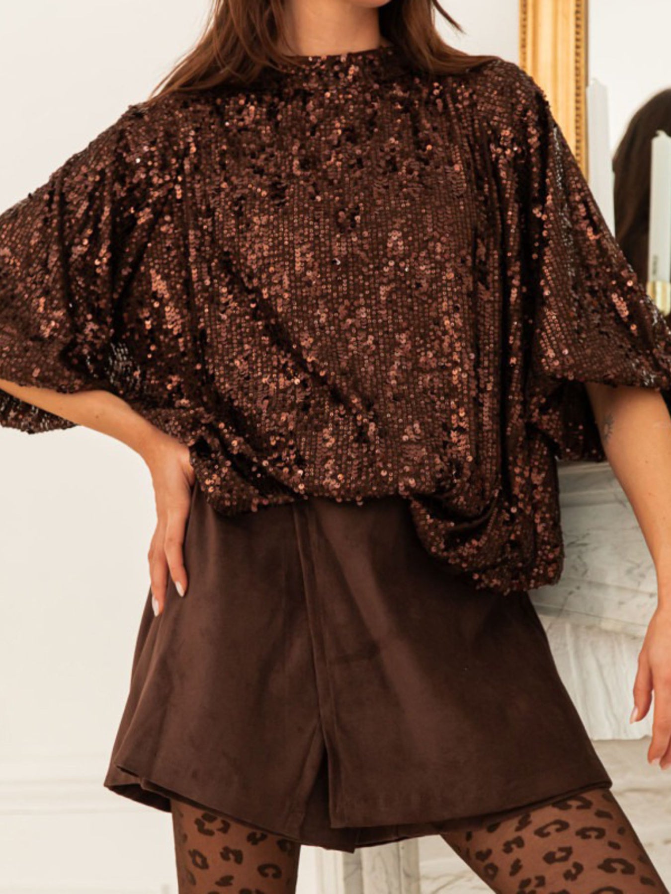 Dazzling Sequin Tie-back Shirt in dark brown with short sleeves and a mock neck.