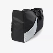Black and silver color block travel bag with zipper pocket detail.