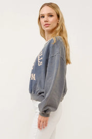Beverly Hills graphic crop sweatshirt in stone with cream lettering, crewneck, and relaxed fit.