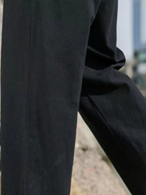 Black drawstring men's sweatpants with a relaxed fit.