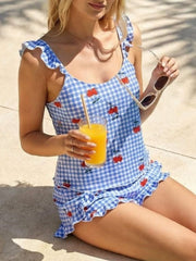 Ruffled cami and shorts set in blue gingham with cherry print and ruffled trim.