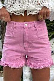 Pink high-rise denim shorts with a frayed hem and a casual fit.