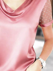 Pink cowl neck blouse with sheer polka dot sleeves and satin trim.