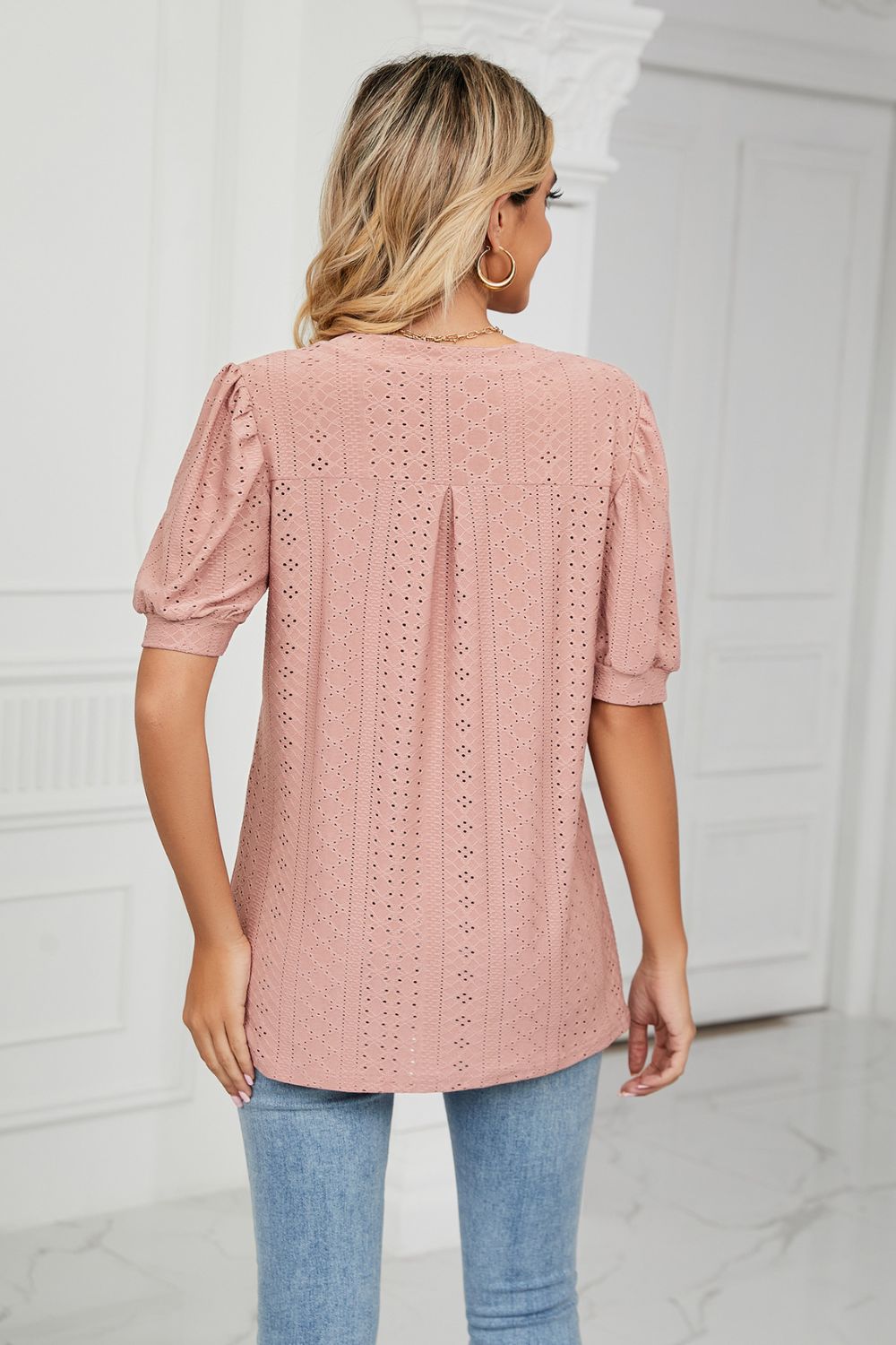 Mauve perforated puff sleeve blouse with eyelet detail and pintuck back.