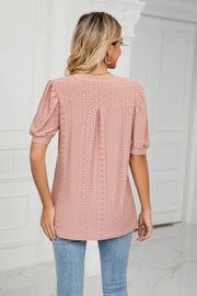 Mauve perforated puff sleeve blouse with eyelet detail and pintuck back.
