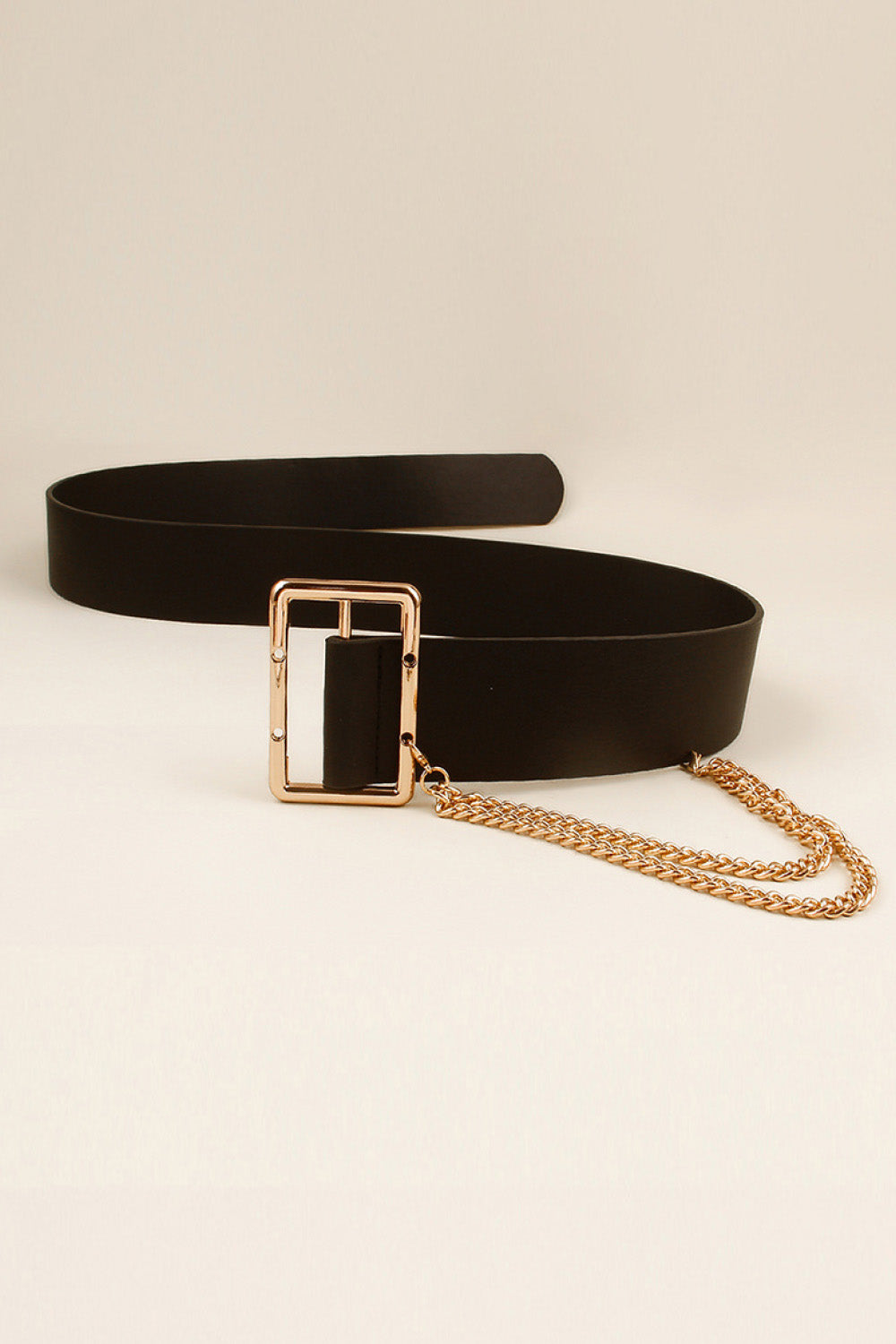 Black faux leather belt with gold buckle and draped chain detail.