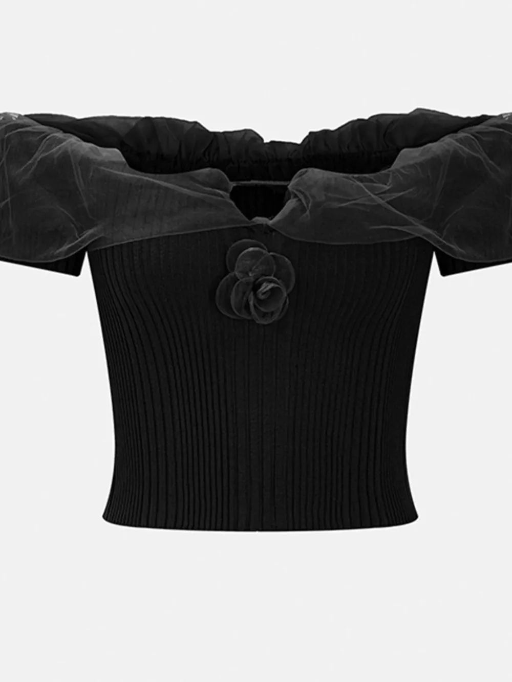 Black off-shoulder ruffled knit t-shirt with sheer sleeves and a floral applique.
