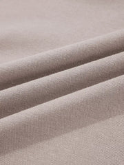 Multi-tonal relaxed fit cotton hoodie in a soft taupe color, showing fabric texture.