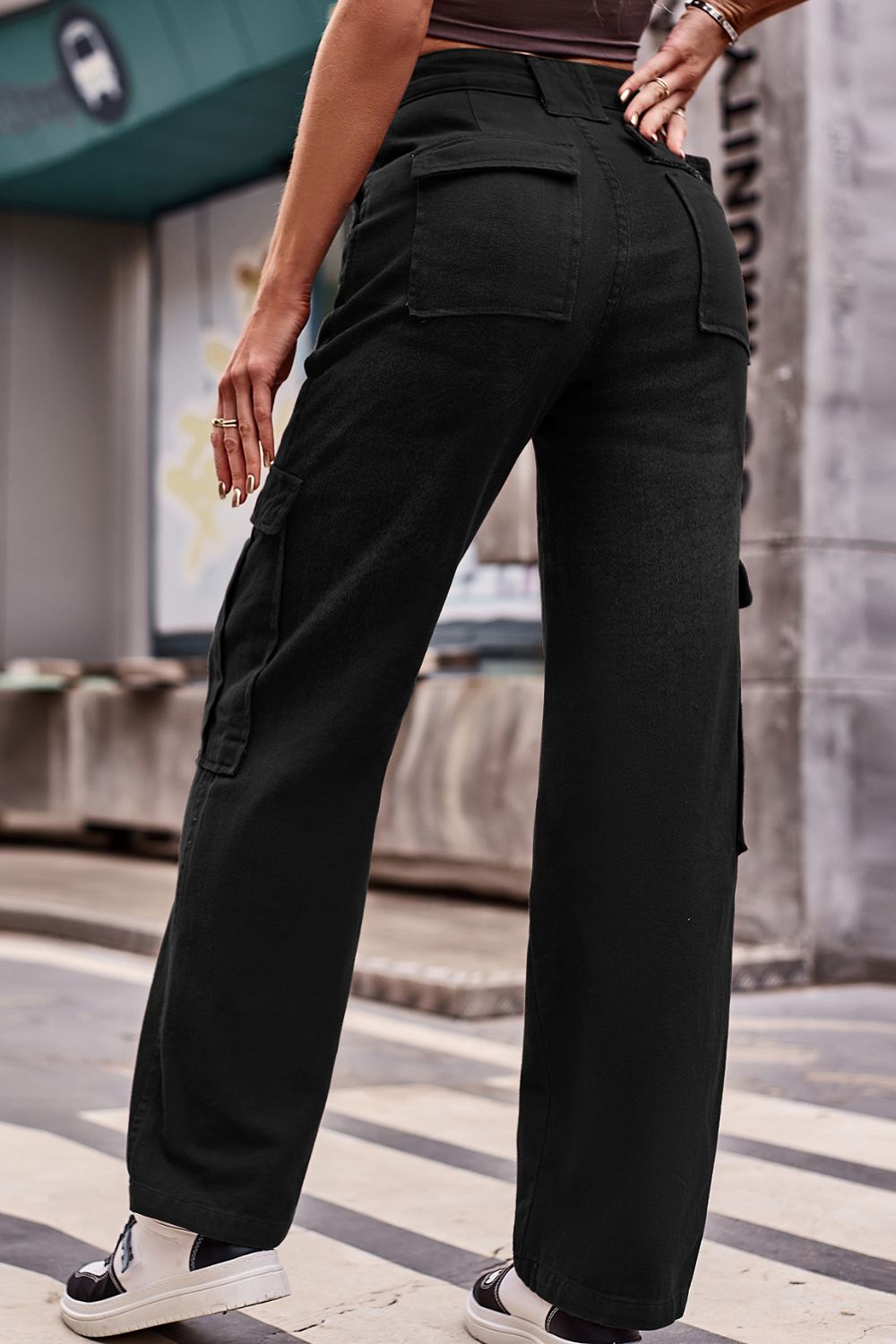 Black utility pocket wide leg cargo pants with a relaxed fit.