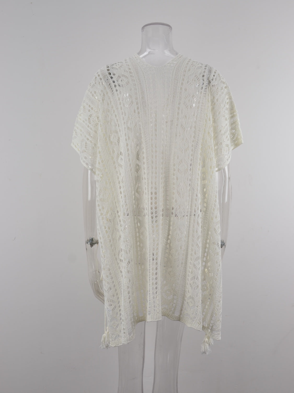 White open-knit V-neck beach cover-up with short sleeves and tassel details.