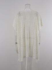 White open-knit V-neck beach cover-up with short sleeves and tassel details.