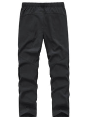 Black men's sweatpants with elastic waistband and paneled legs.