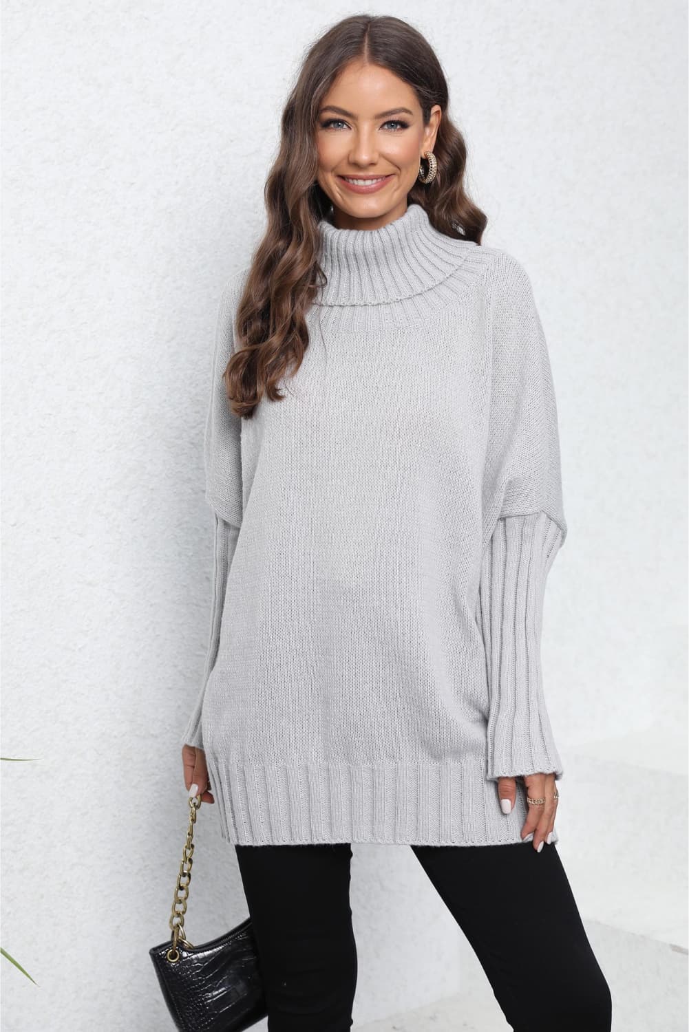 Light Gray ribbed turtleneck sweater with batwing sleeves and a relaxed fit.
