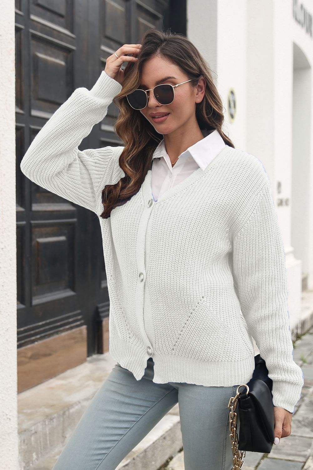Chunky knit button-through cardigan in ivory with V-neck and long sleeves.
