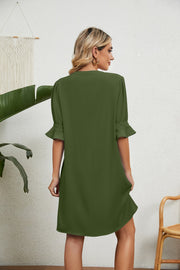 Green V-neck shift dress with flutter sleeves and a relaxed fit.