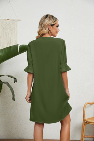 Green V-neck shift dress with flutter sleeves and a relaxed fit.