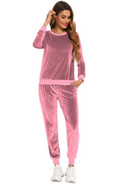 Dusty pink velvet lounge set with contrast trim, crew neck sweatshirt and jogger pants.