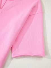 Pink cotton romper with half sleeves and raw hem detail
