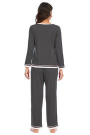 Charcoal long sleeve pajama set with contrast trim on neckline, cuffs, and hem.