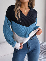Chevron block knit polo sweater with collar and long sleeves in black, blue, and white acrylic.